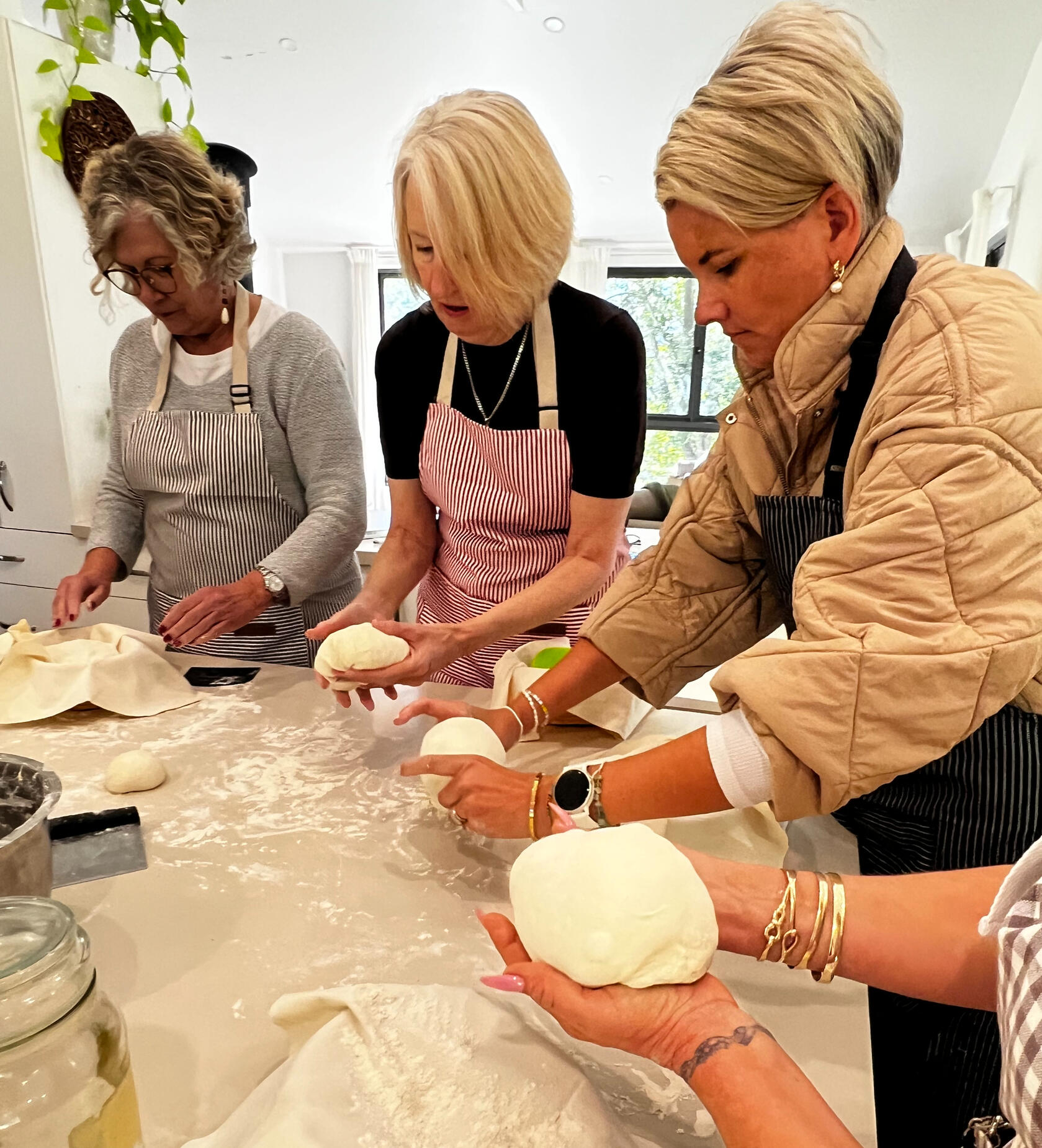 Hands shaping sourdough bread at a Berry NSW workshop